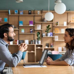 indian hr employer listening latin candidate at jo H2DUS6Q scaled